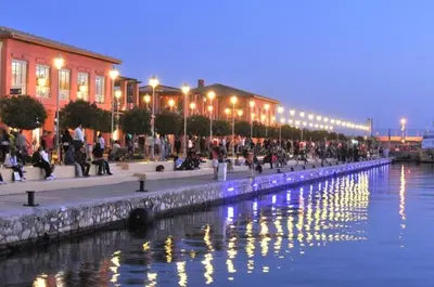 a row of lights next to a body of water at Elegant Seaside 2 Floor Apartment in Athens