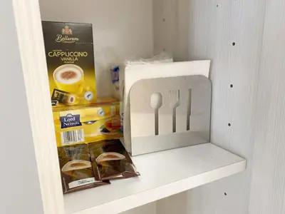 a drawer with a knife and fork and a box of food at near Acropolis new 2 bedrooms apt in Koukaki in Athens