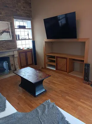 a living room with a television and a coffee table at Full Acropolis View Apartment in Athens