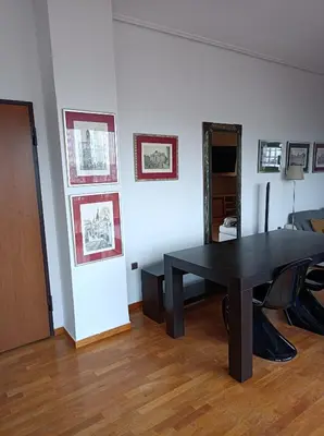 a dining room with a black table in a room at Full Acropolis View Apartment in Athens
