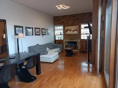 a living room with a couch and a table at Full Acropolis View Apartment in Athens