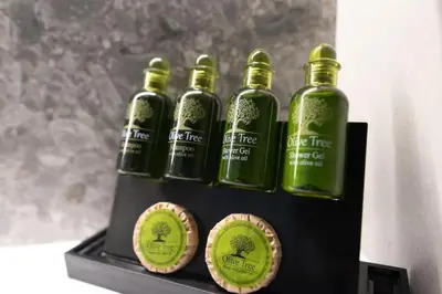 a group of five green bottles on a display at New-built apartment close to Athens city centre (Form_E1) in Athens