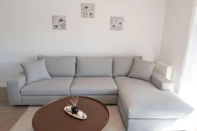 a living room with a couch and a table at New-built apartment close to Athens city centre (Form_E1) in Athens