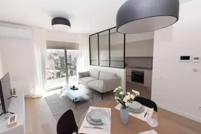 a living room with a table and a couch at Modern apartment close to Athens city center (Form_F2) in Athens