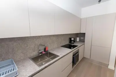 a kitchen with white cabinets and a sink at Modern apartment close to Athens city center (Form_F2) in Athens