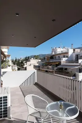 a patio with a table and chairs on a balcony at Modern apartment close to Athens city center (Form_F2) in Athens