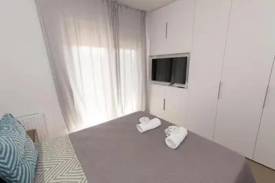 a bedroom with two towels on a bed at Modern apartment close to Athens city center (Form_F2) in Athens
