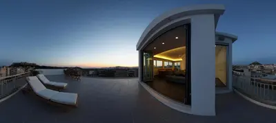 a building with a large letter t on the roof at Acropolis Panorama View Penthouse with Private Terraces A Contemporary Parthenon in Athens