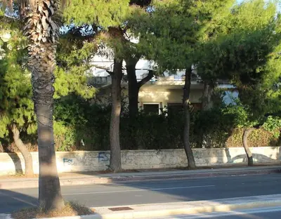 a row of trees on the side of a street at Athens Riviera coast apartment in Athens