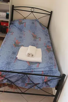 a chair with a cat sleeping on top of it at Athens Riviera coast apartment in Athens