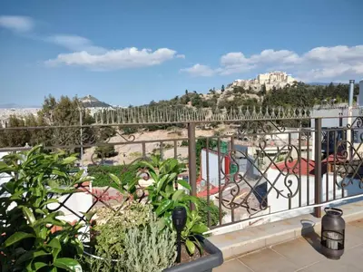 a balcony with a view of a park at A perfect spot in Athens