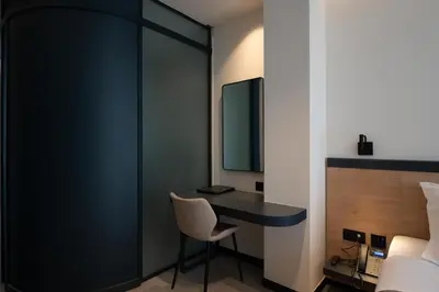 a bedroom with a desk and a bed at Nema Hotel Athens in Athens