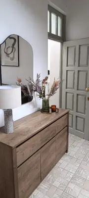 a wooden dresser in a room with a mirror at Apeiron Acropolis Suites in Athens