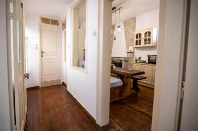 a hallway of a kitchen with a table in it at Apeiron Acropolis Suites in Athens