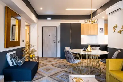 a living room with a table and chairs at Exarcheia Vibe Penthouse 1 in Athens