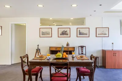 a dining room with a table with fruit on it at Arditou Akropolis Apartments-Suites in Athens