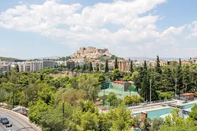 a view of a city with a castle in the background at Arditou Akropolis Apartments-Suites in Athens