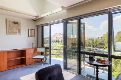 a living room with a view of the city at Arditou Akropolis Apartments-Suites in Athens