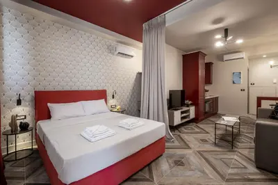 a bedroom with a bed and a living room at Athens Exarcheia Vibe 2 in Athens
