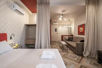 a hotel room with a bed and a couch at Athens Exarcheia Vibe 2 in Athens