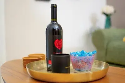 a bottle of wine on a tray on a table at Crown Syntagma Apartment in Athens