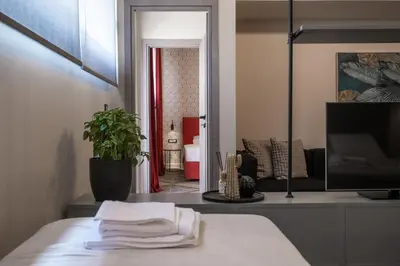a room with a table with a tv and a living room at Athens Exarcheia Vibe 3 in Athens