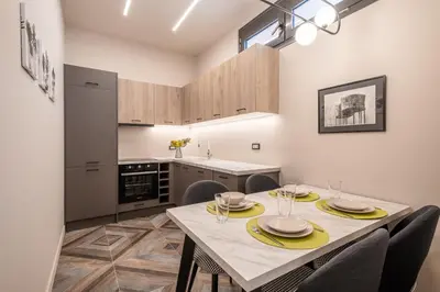 a kitchen with a table and chairs in a room at Athens Exarcheia Vibe 3 in Athens