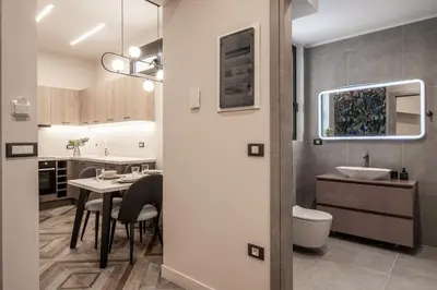 a kitchen and dining room with a table and a sink at Athens Exarcheia Vibe 3 in Athens