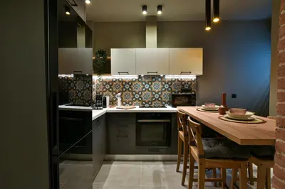 a kitchen with a wooden table and a counter top at NewVintage Apartment in Athens