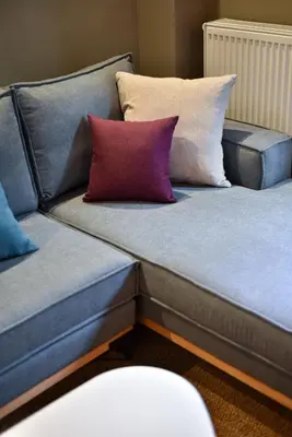 two couches with pillows sitting next to each other at NewVintage Apartment in Athens
