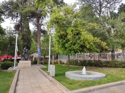 a statue of a man in a park with a fountain at Διαμέρισμα studioJoy4stay στο Χαλάνδρι in Athens