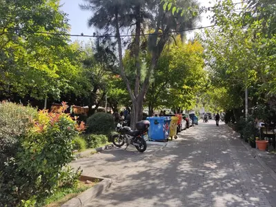 a bike parked on the side of a street at Διαμέρισμα studioJoy4stay στο Χαλάνδρι in Athens