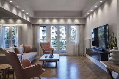 a living room with a couch and a tv at Urban Heights 3BD Apt, next to Hilton in Athens