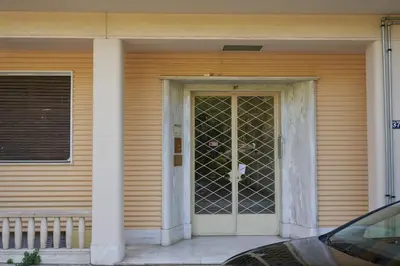 a front door of a house with a glass door at Urban Heights 3BD Apt, next to Hilton in Athens