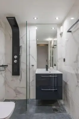 a bathroom with a shower and a toilet and a sink at The HostMaster Artistic Inn in Athens