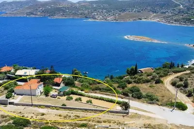 an aerial view of a house next to a body of water at Villa Anemos in Dhaskalión