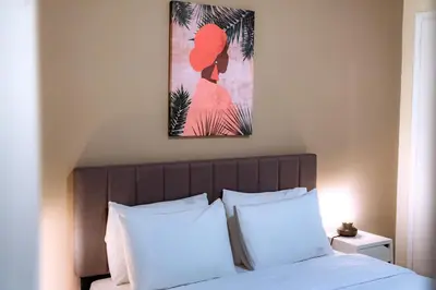 a bedroom with a bed with two white pillows at Plaka Apartment in Athens