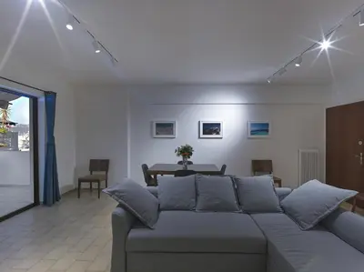 a living room with a couch and a table at 2 bedroom apartment close to children's hospital in Athens