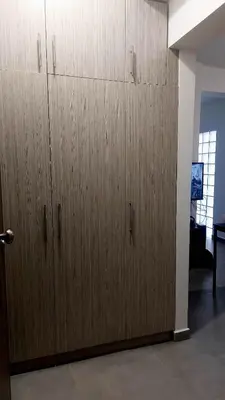 a pair of wooden cabinets in a room at Cozy Nest in Athens