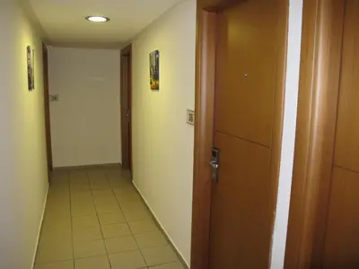 a hallway with a door and a tile floor at Hotel Solomou Athens in Athens