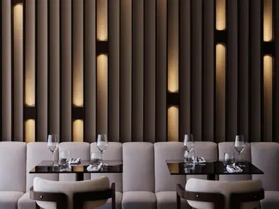 a restaurant with two tables and chairs with wine glasses at Electra Rhythm Athens in Athens