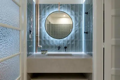 a bathroom with a sink and a mirror at An Outstanding 3 bdrm Apartment in the Heart of Athens in Athens