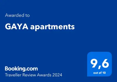 a blue sign with the text awarded to gaya apartments at GAYA apartments in Athens