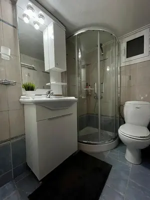 a bathroom with a shower and a toilet and a sink at Stay Calm in Athens
