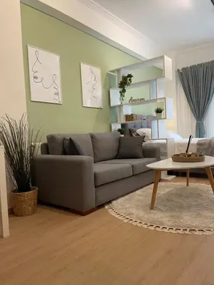 a living room with a couch and a table at Stay Calm in Athens
