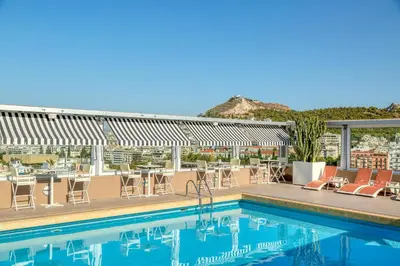 a pool on the roof of a hotel at Divani Caravel in Athens