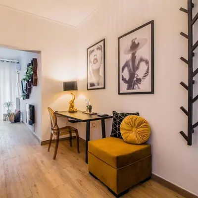 a living room with a table and a chair at Classy Apartment in Athens in Athens