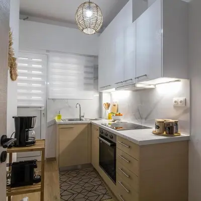 a kitchen with a sink and a stove top oven at Classy Apartment in Athens in Athens