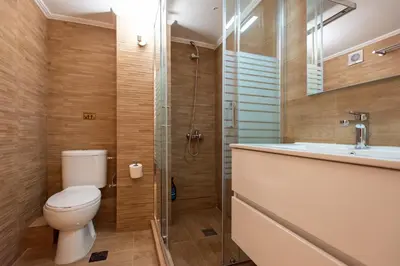 a bathroom with a toilet and a shower and a sink at Blue Ark Boho Stay at Acropolis in Athens