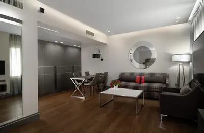 a living room with a couch and a table at Holiday Suites in Athens